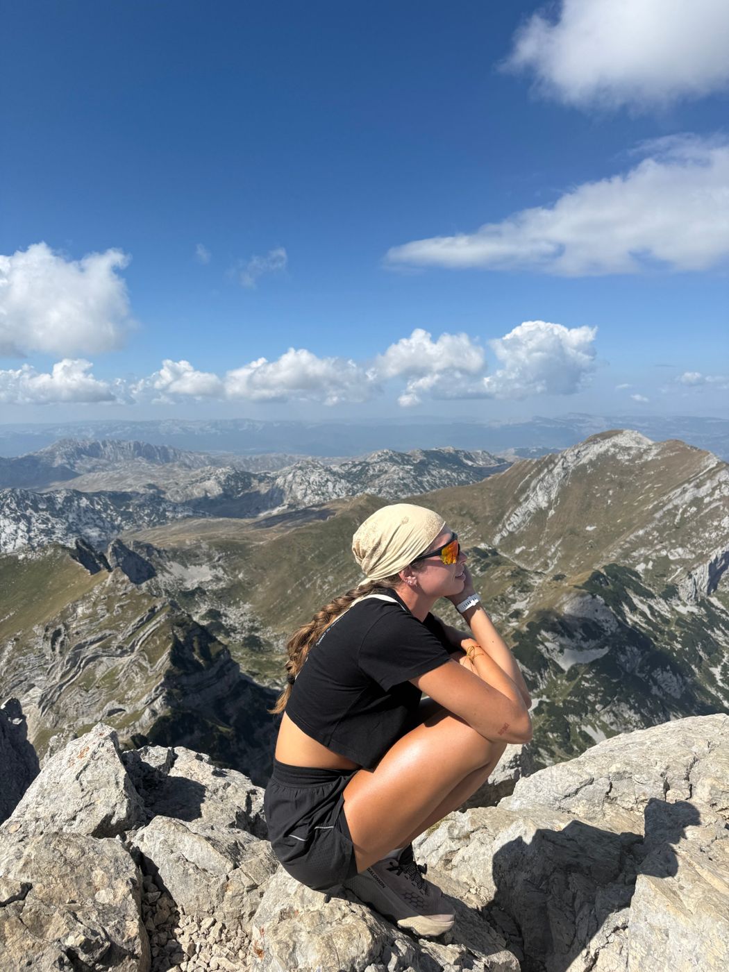 Amie on a mountain summit